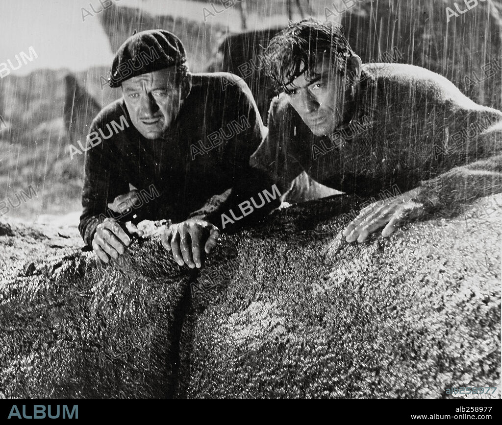 DAVID NIVEN and GREGORY PECK in THE GUNS OF NAVARONE, 1961, directed by J. LEE THOMPSON. Copyright COLUMBIA PICTURES.
