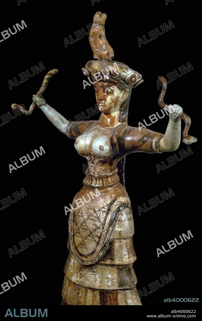 Minoan faience figure of a Snake Goddess, from the central shrine of the Minoan Royal Palace at Knossos in Crete. Her bare breats emphasise the maternal nature of the goddess. The small panther on her head may symbolise 'Mistress of the Animals', and the snakes symbolise underground deities, or the protective household snakes. In the Archaeological Museum in Heracleion, Crete, 17th century BC.