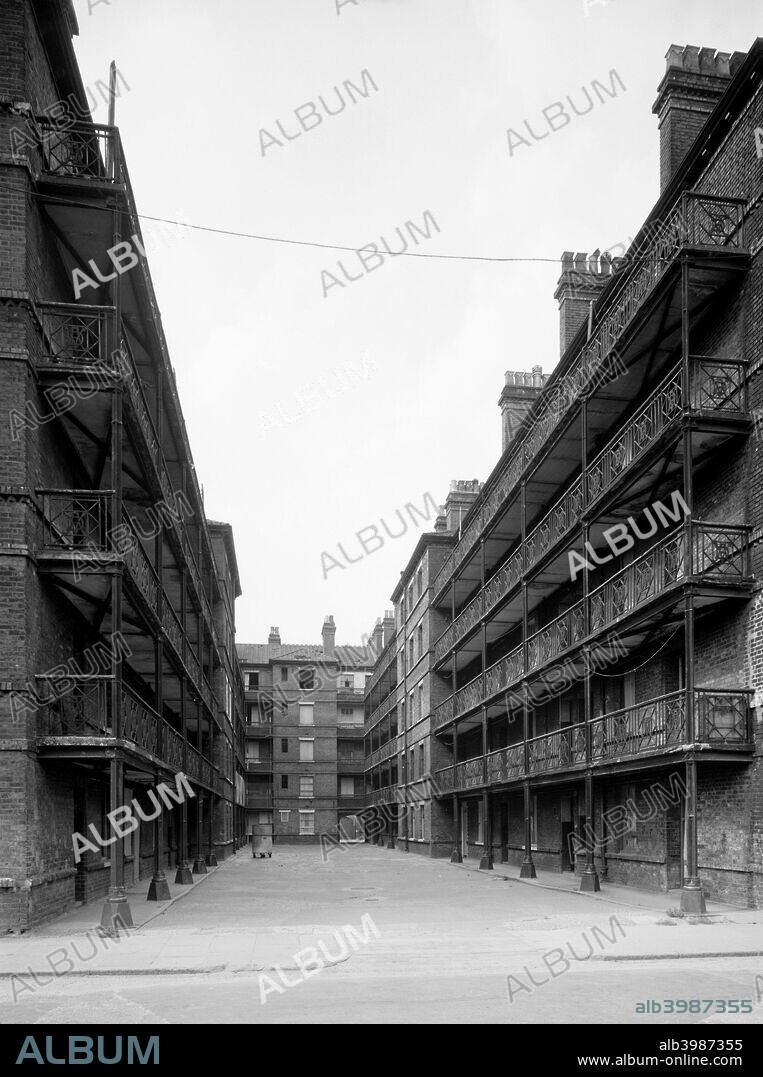Beaconsfield Buildings, Randells Road, Islington, London, 1969. A view through the courtyard of the flats immediately west of Gifford Street just prior to demolition. These Victorian tenements date from around 1879 and were intended to provide decent housing for working people at affordable rents. The site is now occupied by Bingfield Park.