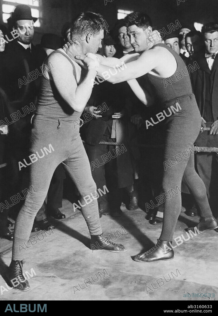 Westchester County, New York:  March, 1916 Boxer Frank Moran training for his upcomiong heavyweight championship bout with Jess Willard. Here he is seen wrestling with boxer Frank Kendall at Dal Hawkins Roadhouse training camp.