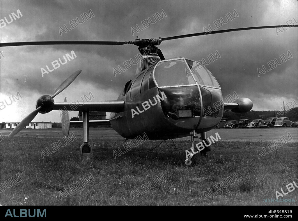 Britain Beat's World Helicopter Speed Record -- A close-up of the Fairey prototype Gyrodyne on the airfield to-day. On the stub-wing can be seen the air screw that is responsible for most of the forward propulsion. A new world helicopter speed record was established today at White Waltham airfield, near Maidenhead, by Squadron Leader Basil Arkell, a rotor aircraft test pilot, in the fairey Aviation Company's prototype Gyrodyne. Over four runs his average speed was finally given as 124,3 miles per hour. The former world's official record is given as 76.7. m.p.h. made by a German F.W. 61 helicopter, although an unofficial record of 114.6 m.p.h. was set up by an American Sikorsky R5 military two-seater helicopter last year. June 28, 1948. (Photo by Fox Photos).