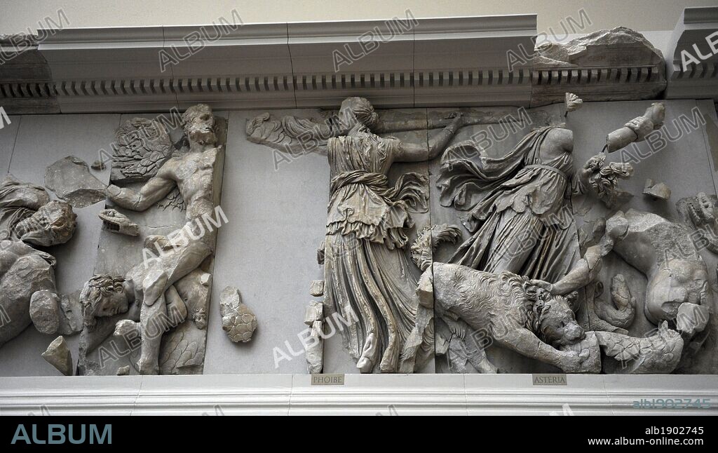 Pergamon Altar. Built by order of Eumenes II Soter. 164-156 BC. Marble and limestone. Gigantomachy. South frieze. The Titan Phoebe with a torch fighting against a winged giant and her daughter Asteria fighting with a sword and a dog. Pergamon Museum. Berlin. Germany.