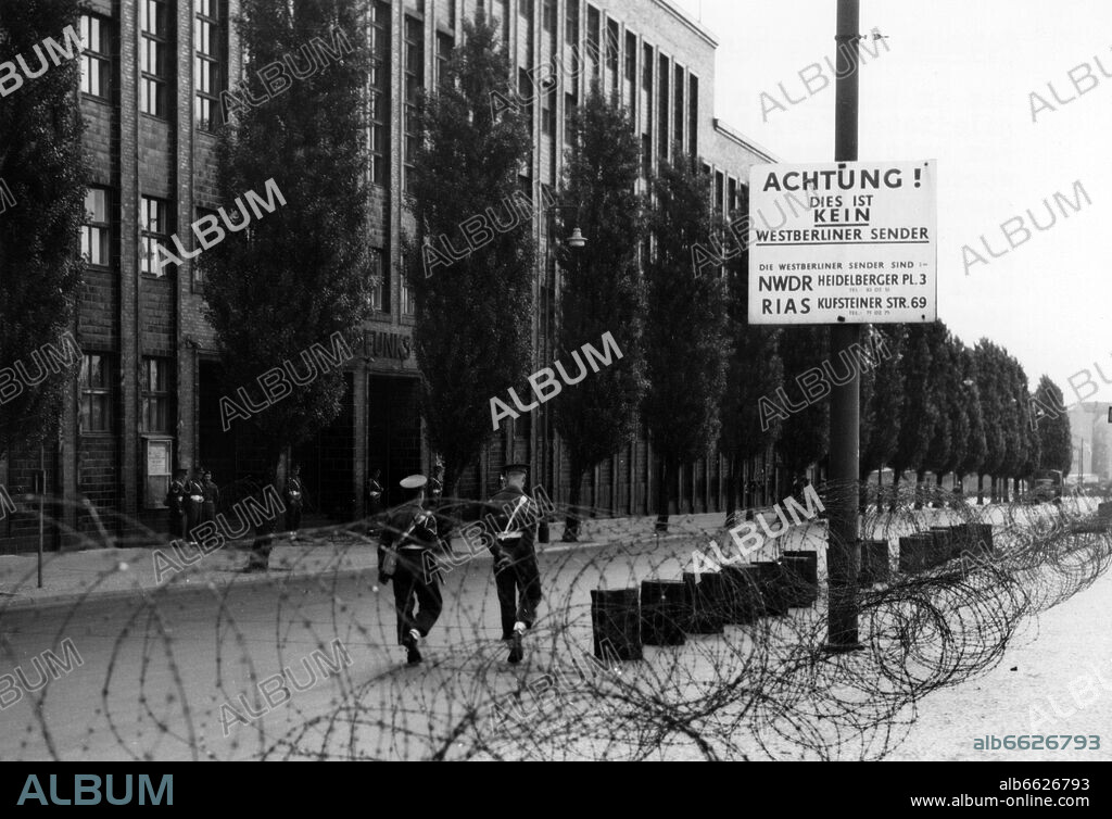 Soldiers of the British army guard the blocking and patrol around the &quot;Haus des Rundfunks&quot; (&quot;House of Broadcasting&quot;) on the 3rd of June in 1952.
Although it was located in the British sector of Berlin, the House of Broadcasting was used by the Broadcast of Berlin and controlled by the Soviets after World War II until 1952.
After a temporary blocking by the British Army, the building was given to the Senate of Berlin only in July 1956, who handed it over to the broadcaster &quot;Freies Berlin&quot; (&quot;Free Berlin&quot;) after extensive renovation works. 03/06/1952