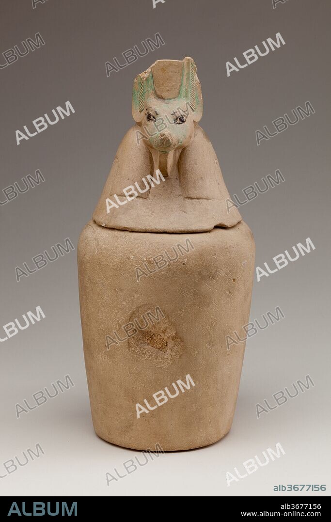 Canopic Jar Representing the Deity Duamutef. Dimensions: H. 31 cm (12 3/16 in); diam. 13.5 cm (5 5/16 in). Dynasty: Dynasty 18-20. Date: ca. 1550-1070 B.C..
Canopic jars were made to hold the internal organs that were removed during mummification. This canopic jar, with its falcon-headed lid, probably held the stomach and was under the protection of the god Duamutef, one of the Four Sons of Horus. The other three jars of the set are 12.183.1a-c.
