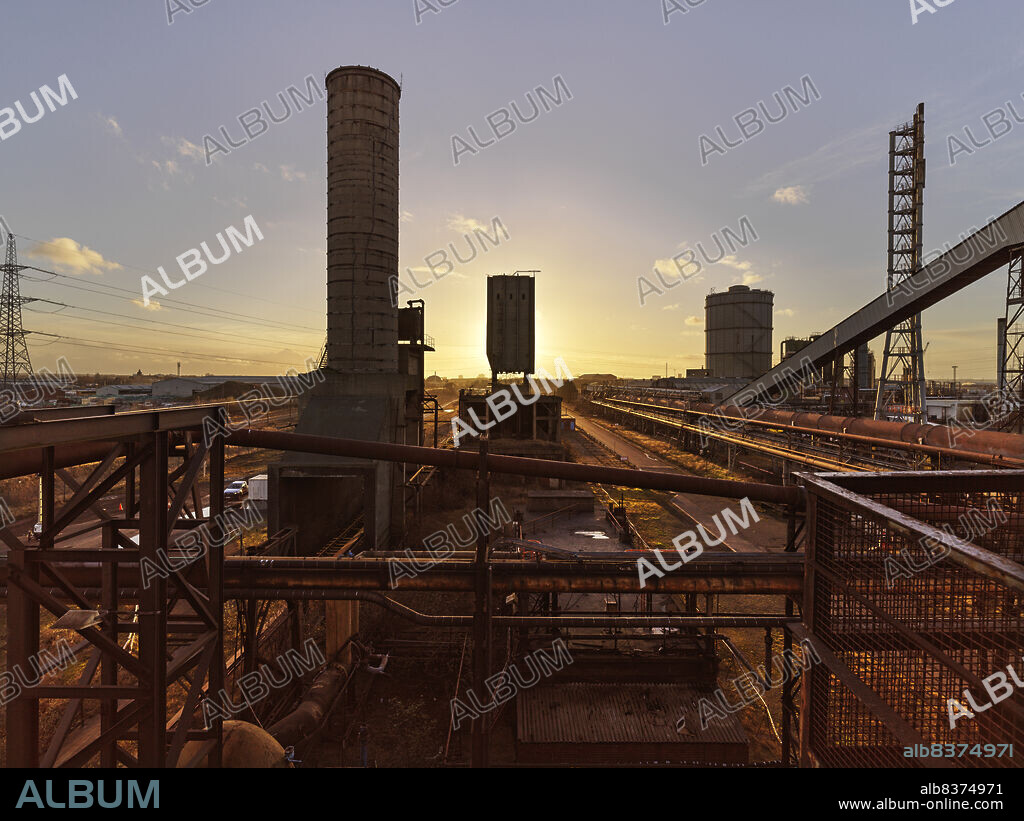 JAMES O DAVIES. Redcar Steel Works, Dorman Long Tower, South Bank, Redcar, Redcar and Cleveland, 12-03-2021. General view of Redcar Steel Works at sunset, looking west towards the Dorman Long Tower, flanked by a quencher and a by-product plant.