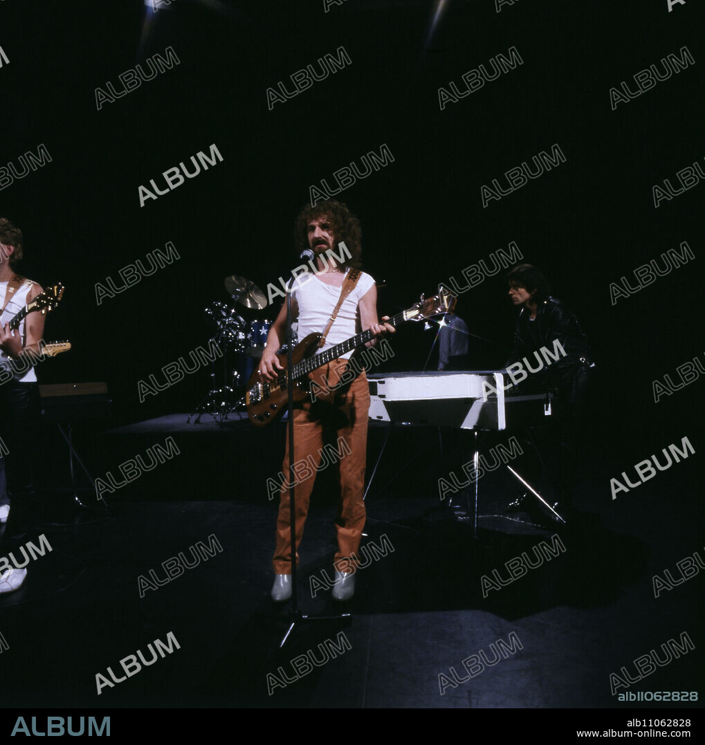 Barclay James Harvest, British progressive rock band, singer and guitarist LES HOLROYD, centre, at a performance, 1983. Barclay James Harvest, British progressive rock group, singer and guitarist LES HOLROYD, centre, performance, 1983.