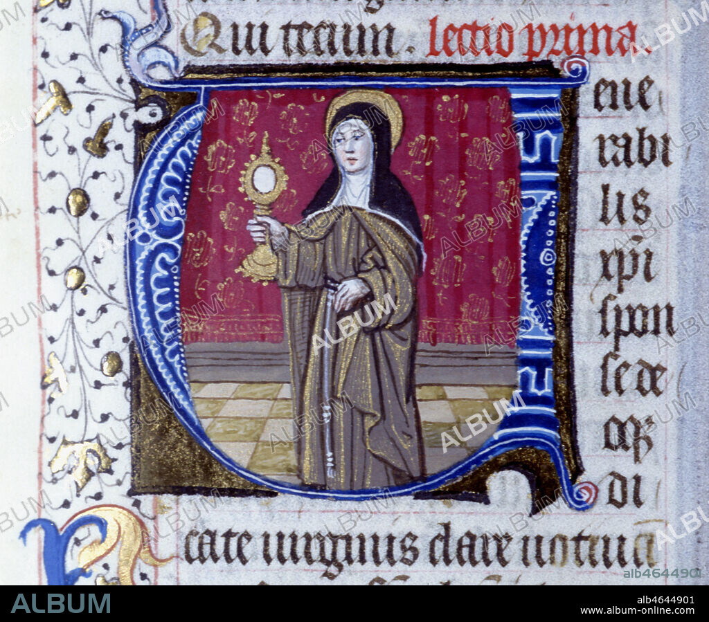 Sainte Claire tenant une montrance et lettrine "V". Enluminure tirée d'un bréviaire du 15ème siècle. (f°513).