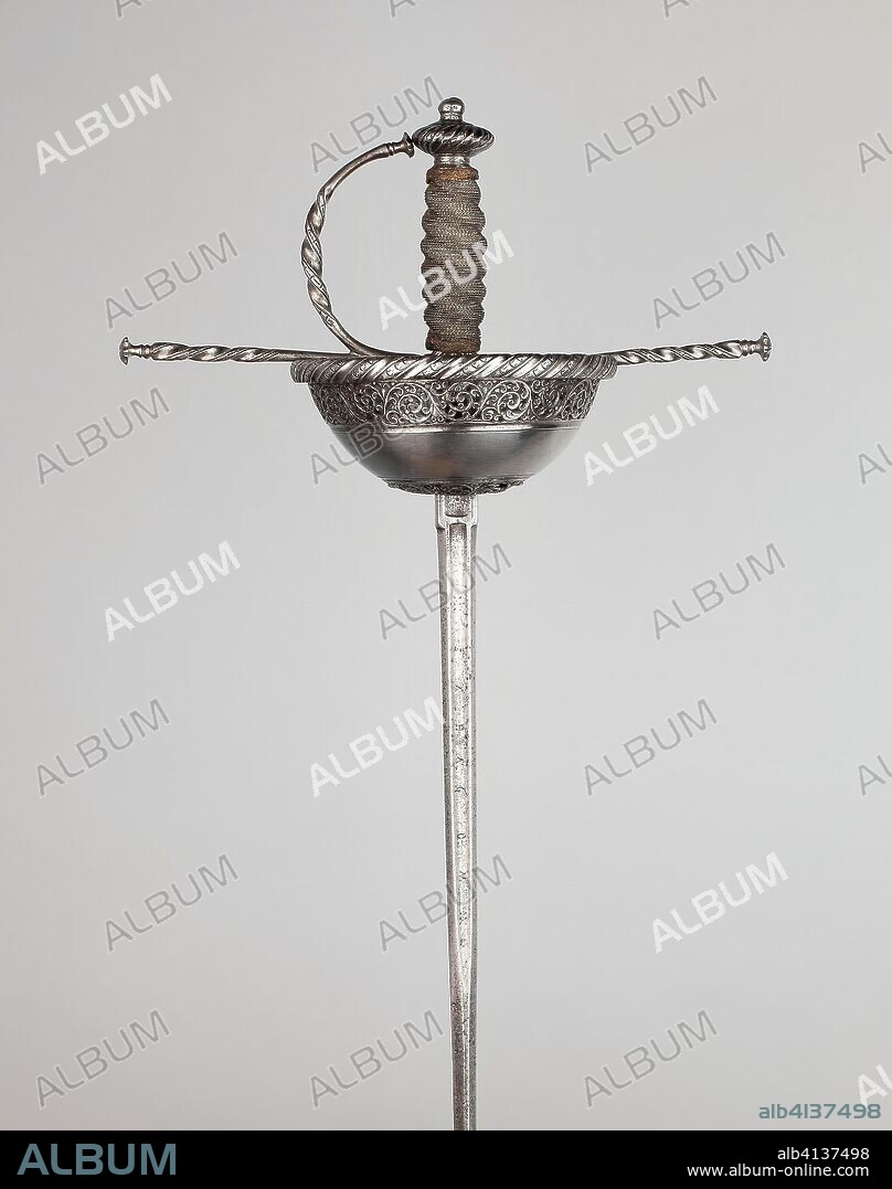 TOMáS DE AYALA. Cup-Hilted Rapier. Bladesmith: Tomas de Ayala (Spanish); Toledo. Date: 1640-1670. Dimensions: Overall L. 108 cm (42 1/2 in.)
Blade L. 92.7 cm (36 1/2 in.)
Wt. 1 lb. 10 oz. Steel, iron, copper, and wood. Origin: Toledo.