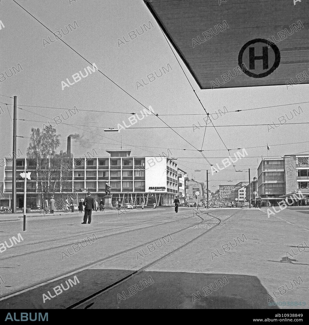 Park Hotel with Friedrich List monument and Merkur department store at Reutlingen, Germany 1959.