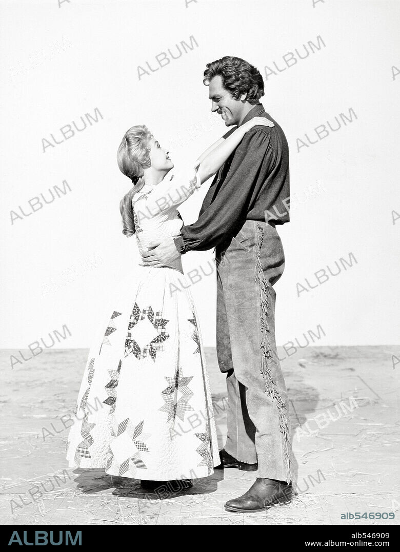 HOWARD KEEL and JANE POWELL in SEVEN BRIDES FOR SEVEN BROTHERS, 1954, directed by STANLEY DONEN. Copyright M.G.M.