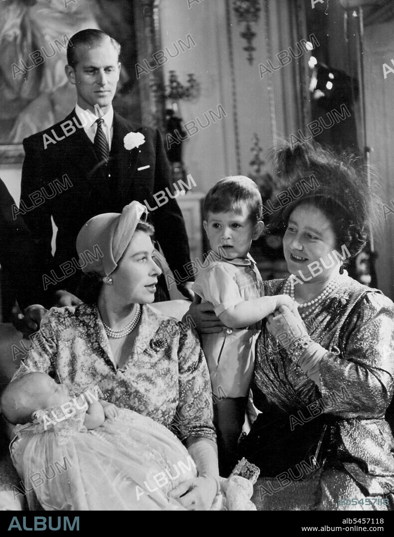 The Christening of Princess Anne - Princess Anne, the second child of H.R.H. Princess Elizabeth and the Duke of Edinburgh, was christened at Buckingham Palace on October 21st, 1950. H.M. The Queen, holding Prince Charles, talks to H.R.H. Princess Elizabeth Who has Princess Anne in her arms. Standing behind is H.R.H. the Duke of Edinburgh. November 08, 1950. (Photo by Baron, Camera Press).