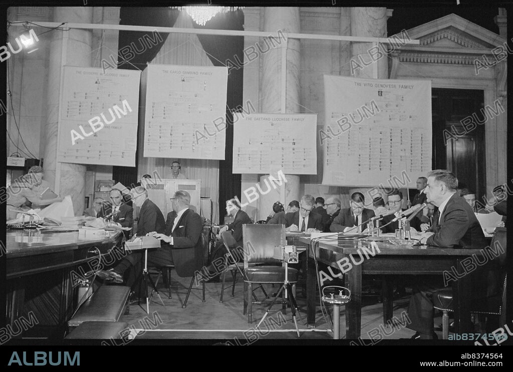 Mafioso Joseph Valachi of the Genovese crime family, testifying about organized crime and the Mafia at a hearing of the Permanent Subcommittee on Investigations of the Senate Committee on Homeland Security and Governmental Affairs, with Mafia organizational charts hanging in room. Contributor Names Trikosko, Marion S., photographer Created / Published 10/08/1963 [8 October 1963] Subject Headings - Valachi, Joseph,--1904-1971--Public appearances - United States.--Congress.--Senate.--Committee on Homeland Security and Governmental Affairs.--Permanent Subcommittee on Investigations--Meetings - Mafia - Organized crime--United States--1960-1970.