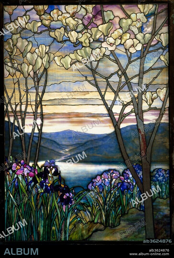 Magnolias and Irises. Culture: American. Designer: Designed by Louis Comfort Tiffany (American, New York 1848-1933 New York). Dimensions: 60 1/4 x 42 in. (153 x 106.7 cm). Maker: Tiffany Studios (1902-32). Date: ca. 1908.
This Tiffany Studios window was designed as a memorial to the Frank family of New York and was originally installed in a mausoleum of a Brooklyn cemetery. The River of Life theme is prevalent in Tiffany landscapes created for memorials. The years between 1900 and 1910 were the height of ecclesiastical window production for Tiffany Studios and figural windows were in high demand. Landscape windows, such as this example, were an appropriate alternative that provided beauty and nature in such scenes.