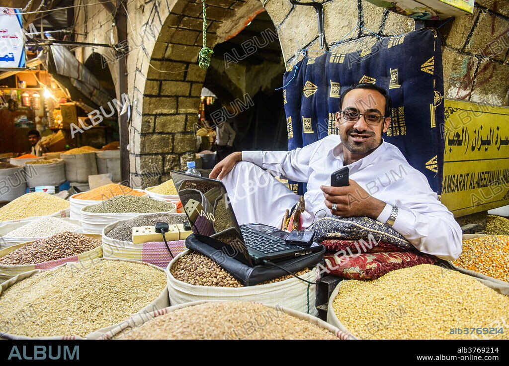 Shopkeeper at the spice market in the Old Town, UNESCO World Heritage Site, Sanaa, Yemen, Middle East.