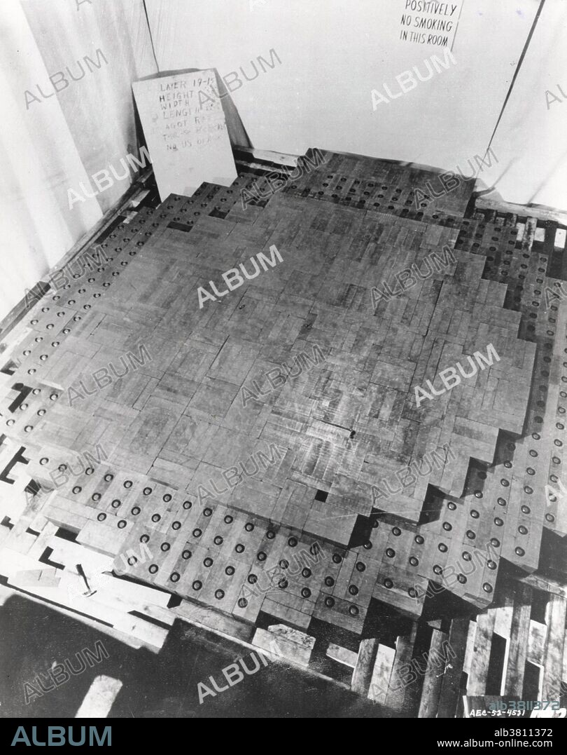 The reactor was a pile of uranium and graphite blocks, assembled under the supervision of the renowned physicist Enrico Fermi, in collaboration with LeÃ³ SzilÃ¡rd, discoverer of the chain reaction. It contained a critical mass of fissile material, together with control rods, and was built as a part of the Manhattan Project by the University of Chicago Metallurgical Laboratory. Chicago Pile-1 (CP-1) was the world's first human-made nuclear reactor. CP-1 was built on a rackets court, under the abandoned west stands of the original Alonzo Stagg Field stadium, at the University of Chicago. The first self-sustaining nuclear chain reaction was initiated in CP-1 on December 2, 1942.