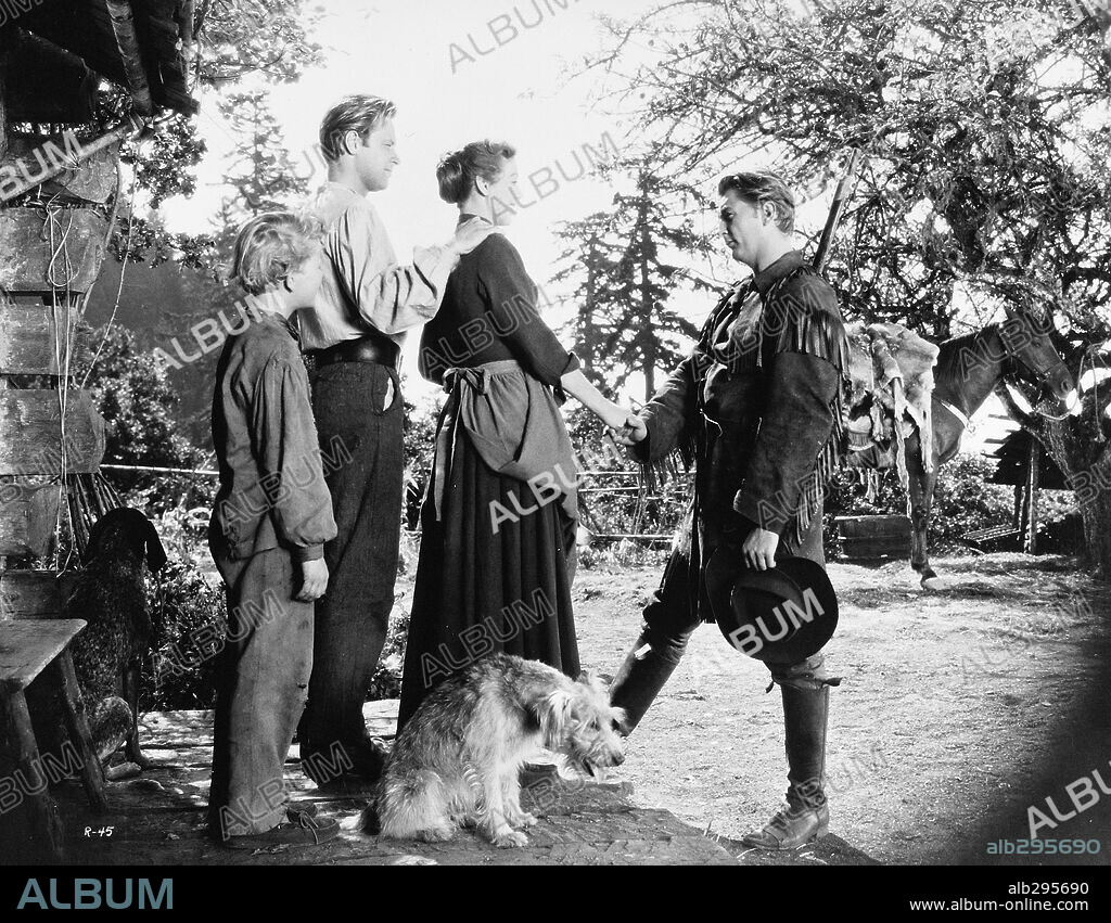 LORETTA YOUNG, ROBERT MITCHUM and WILLIAM HOLDEN in RACHEL AND THE STRANGER, 1948, directed by NORMAN FOSTER. Copyright RKO.