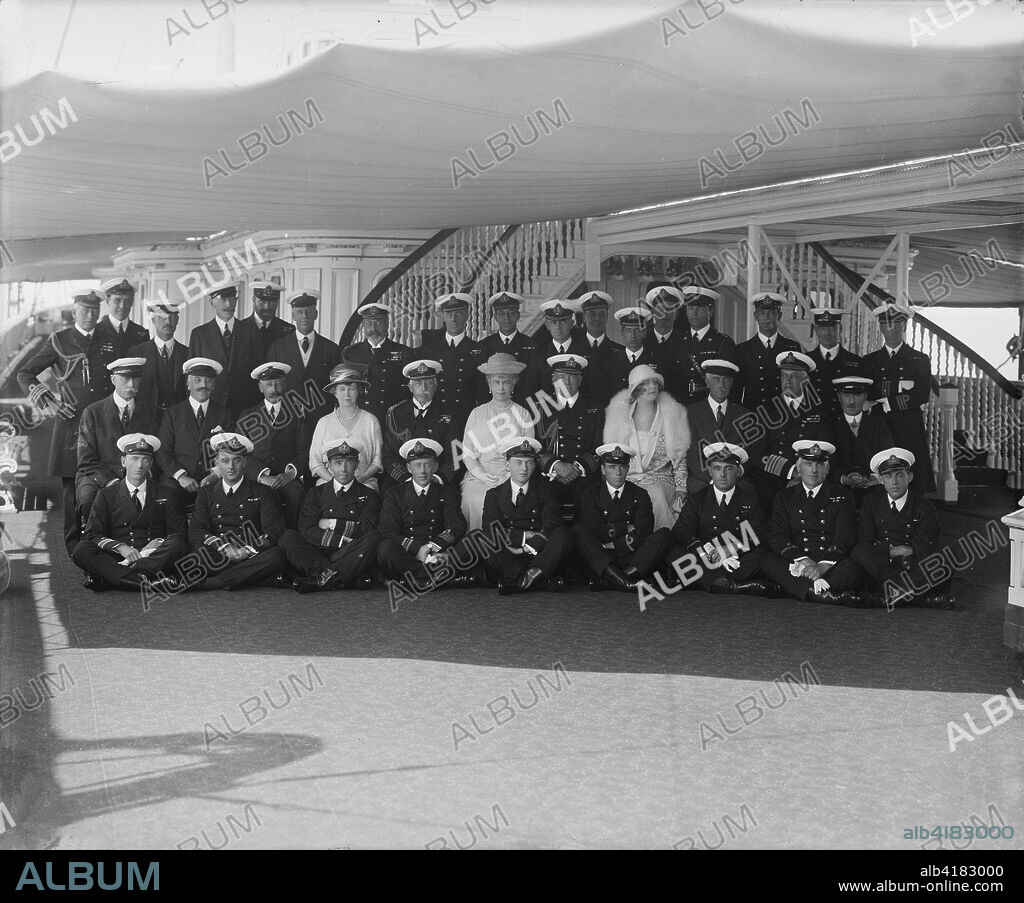 King George V and Queen Mary on board 'HMY Victoria and Albert', 1924. Group portrait of King George V (1865-1936) and Queen Mary (1867-1953) with the crew of the royal yacht 'Victoria and Albert'. Also present are the Marquise d'Hautpoul de Seyre and her brother Sir Harry Stonor, friends and courtiers of the king and queen. 'HMY Victoria and Albert', launched in 1899, was a steamship used by the royal family, particularly for their trips to their summer home, Osborne House, on the Isle of Wight.