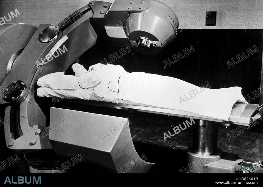 Cobalt therapy or cobalt-60 therapy is the medical use of gamma rays from cobalt-60 radioisotopes to treat conditions such as cancer. The first patient to be treated with Cobalt-60 radiation was treated on October 27, 1951, at Victoria Hospital in London, Ontario. In 1961 cobalt therapy was expected to replace X-ray radiotherapy. The role of the cobalt unit has partly been replaced by the linear accelerator, which can generate higher energy radiation. Cobalt treatment still has a useful role to play in certain applications and is still in widespread use worldwide, since the machinery is relatively reliable and simple to maintain compared to the modern linear accelerator. No photographer credited, undated.