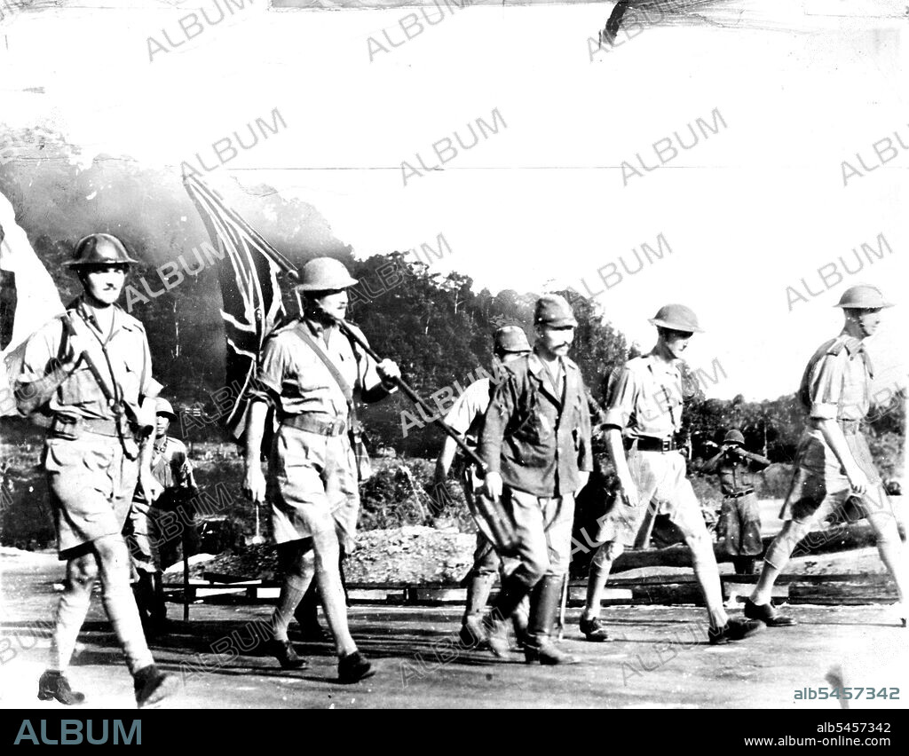 The British party led by General Percival (extreme right) accompanied by Japanese officers on air way to talk terms for the Surrender of Singapore.Singapore Surrender -- Japs SayThe Japanese say this picture shows British Officers at Singapore on the way to meet Japanese Lieut. Gen. Tomoyuki to talk surrender terms. Man at extreme ***** is identified as British Commander, Lieut. Gen. A. E. Percival; man in centre as a Japanese officer, This picture reached the United States by way of Brazil. August 26, 1942. (Photo by Associated Press Photo).