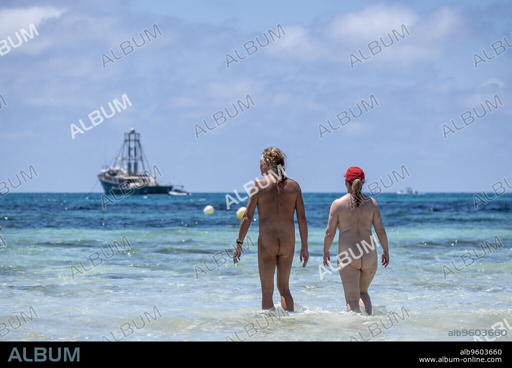 nudist couple bathing, Es Trenc beach, Campos municipality, Mallorca, Balearic Islands, Spain.