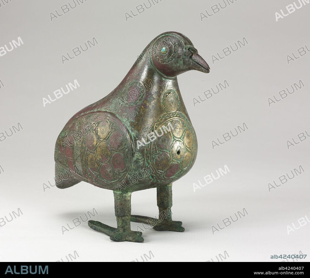 Bird-shaped Vessel, 1100s. Iran, Seljuk Period, 12th Century. Bronze, cast, with chased and chiseled decoration; eyes inlaid with blue glass; overall: 17.5 x 9.5 cm (6 7/8 x 3 3/4 in.).