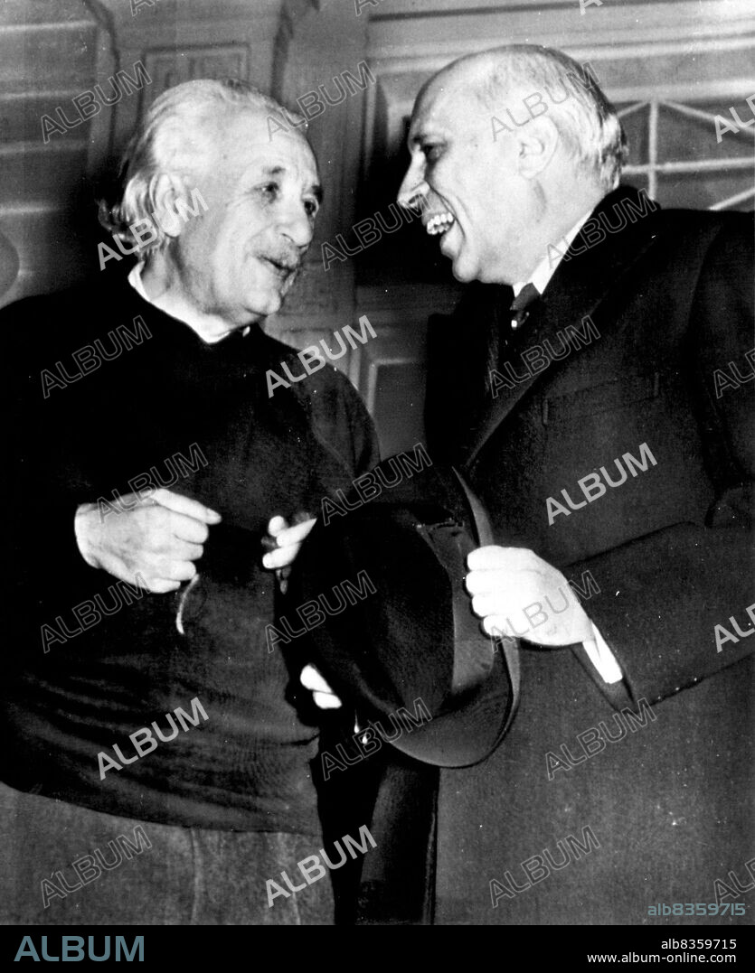 Relatively Informal - Professor Albert Einstein (left) and his guest, Prime Minister Jawaharlal Nehru of India, talk informally on the porch of Einstein's home here today during the Prime Minister's short visit to Princeton University. Professor Einstein, wearing a blue jersey and puffing a pipe, joked and laughed with his guest while neighbors watched from nearby yards. November 05, 1949. (Photo by AP Wirephoto).