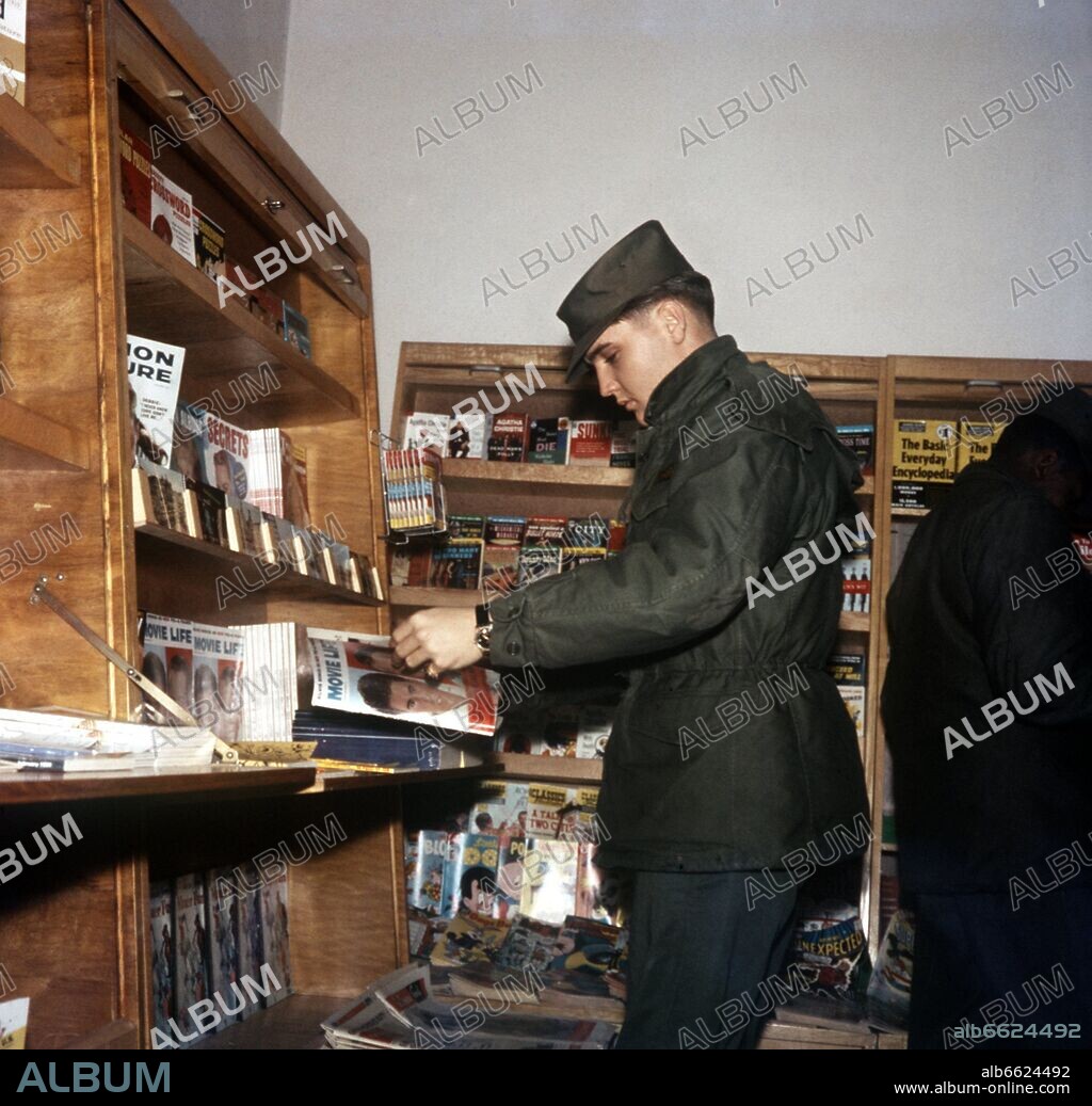 Elvis Presley goes shopping in a PX (that is Post Exchange, American military shop). The American Rock'n Roll singer was stationed in Friedberg (Hesse) in the context of his military service in the US Army in the 1950s and will leave Germany from Frankfurt am Main in a military airplane on the 2nd of March in 1960. 30/11/1958
