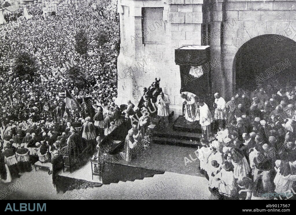 Black and white photograph of Cardinal Eugenio Pacelli (1876-1958), later Pope Pius XII, in Liseaux, celebrating a religious service in front of the basilica in the presence of a large crowd.