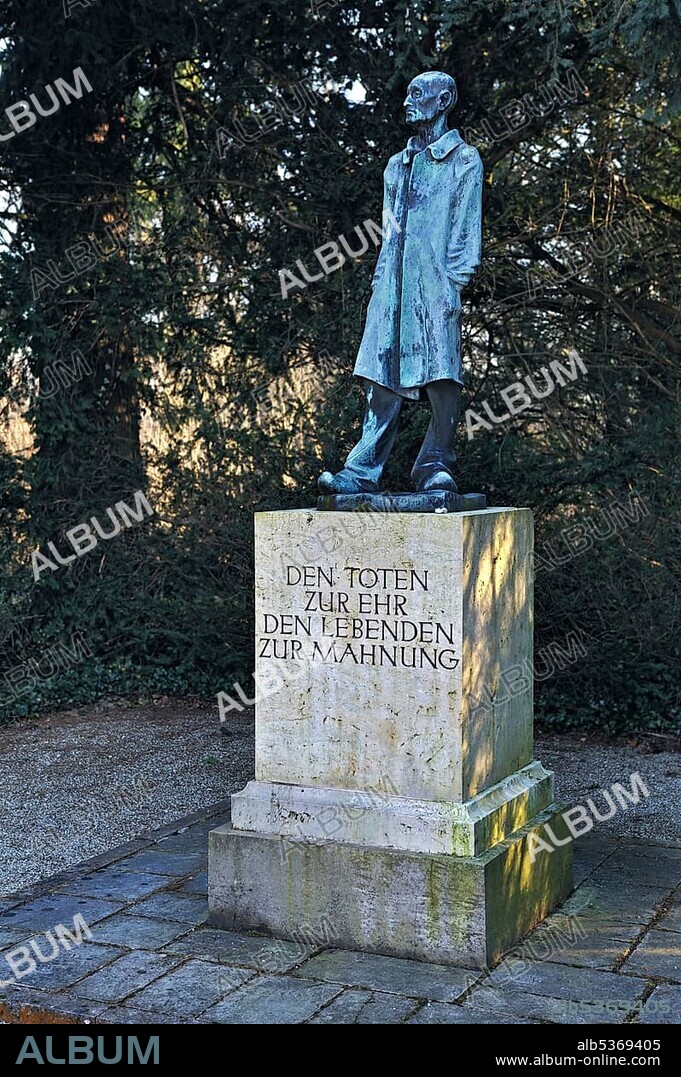 Statue "Der unbekannte Haeftling", German for "the unknown prisoner" by Fritz Koelle outside the concentration camp grounds, Dachau near Munich, Bavaria, Germany, Europe.