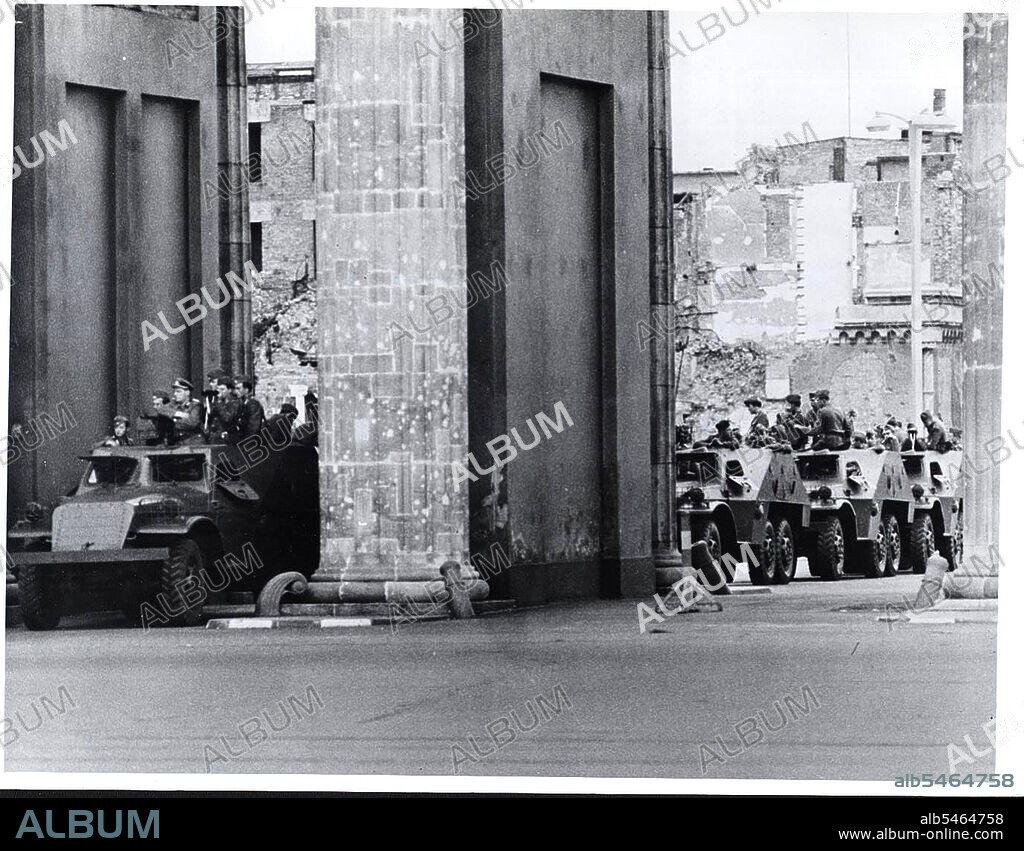 Berlin Wall Photo -  August 1961 - A Column of East German Armored Cars Lines Up Behind Brandenburg Gate Against Background of War-Scarred Buildings of East Berlin.