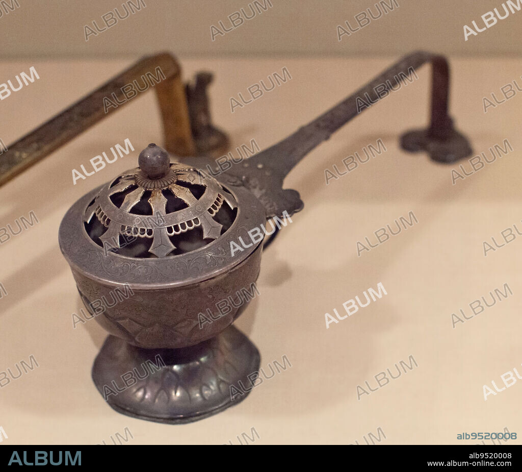 Long-handled Censer, 18th-19th century, Unknown Japanese, 5 5/16 x 13 3/16 x 3 11/16 in. (13.49 x 33.5 x 9.37 cm), Silver with traces of gilding, Japan, 18th-19th century, The long-handled censor is an important symbol of authority, held by high-ranking priests as they lead other monks through the temple to the main worship hall. In Buddhist ritual, the burning of incense before a holy image is one of six devotions considered to be effective in accruing religious merit. The diffusion of fragrant smoke symbolizes the permeation of Buddhism throughout the universe.