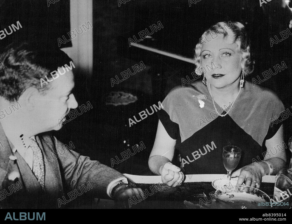 The Tauber Triangle. Carlotta Vanconti Claims He Is Still Her Husband.Mr. Carlotta Canconti-Tauber, photographed whilst talking over the case with on. Emmanuel *****. Her lawyer in her Vienna Home. On July 6.The recent announcement of his engagement to Diana-Napier, young British film star, by Richard Taube, The well known tenor, Has resulted in Indignant protests and a threatened law-suit from Carlotta Vanconto-Tauber, whom the famous singer married in Vienna 9-years ago.  September 19, 1935. (Photo by Associated Press Photo).