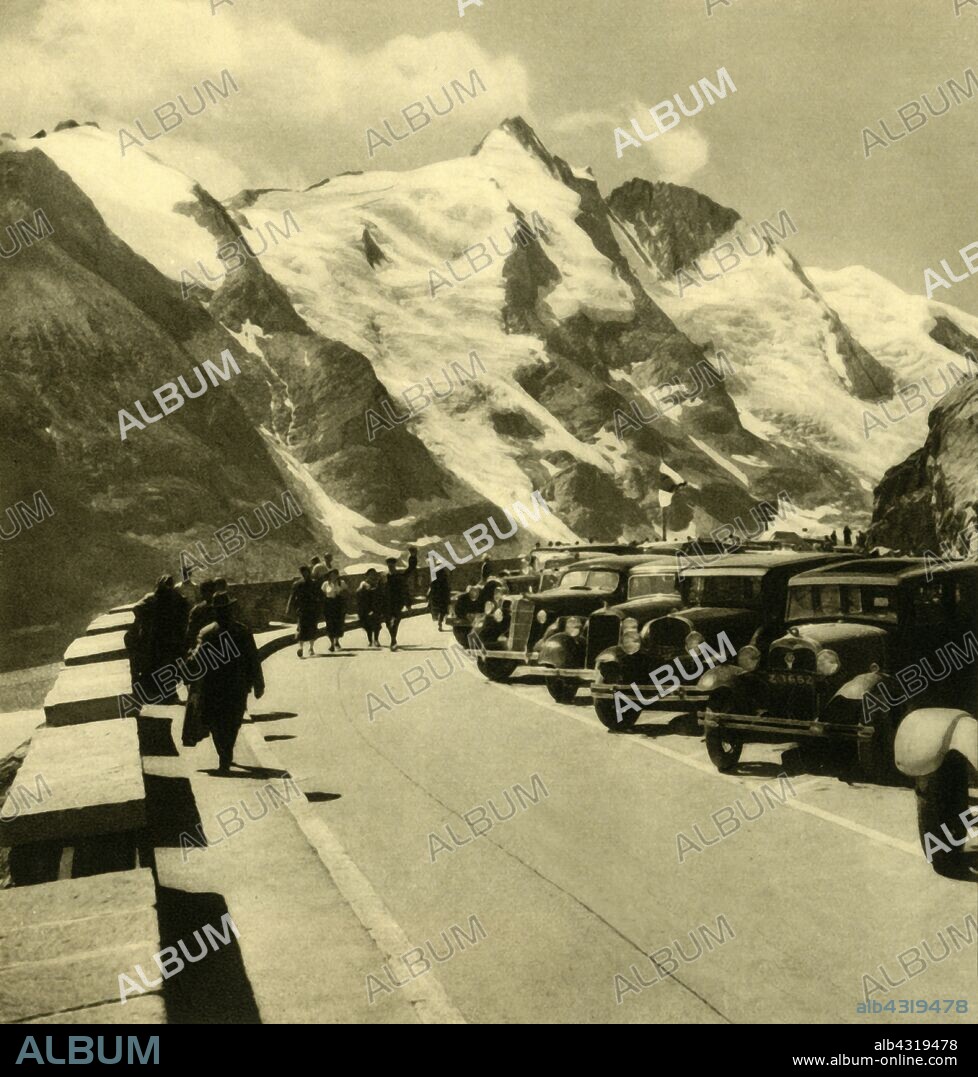 The Kaiser-Franz-Josefs-Höhe look-out point on the Grossglockner High Alpine Road, Austria, c1935. Stopping place offering panoramic views, named after a visit by Emperor Franz Joseph I of Austria in 1856. The Großglocknerstraße, named after the Großglockner, Austria's highest mountain, is the highest surfaced mountain pass road in the country. It was opened in August 1935. From "Österreich - Land Und Volk", (Austria, Land and People). [R. Lechner (Wilhelm Müller), Vienna, c1935].