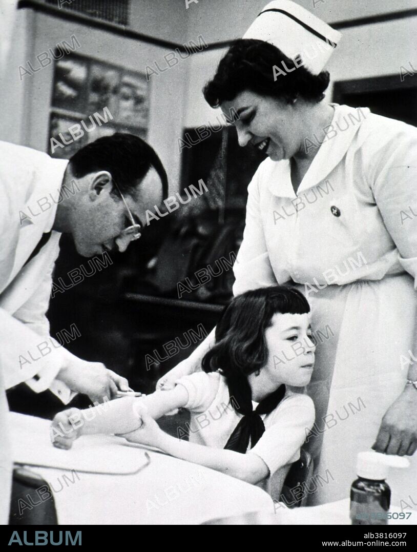 Jonas Edward Salk (October 28, 1914 - June 23, 1995) was an American medical researcher and virologist. He attended New York University School of Medicine, later choosing to do medical research instead of becoming a practicing physician. In 1948, he undertook a project funded by the National Foundation for Infantile Paralysis to determine the number of different types of polio virus. Salk saw an opportunity to extend this project towards developing a vaccine against polio, and, together with the skilled research team he assembled, devoted himself to this work for the next seven years. The field trial set up to test the Salk vaccine involved 20,000 physicians and public health officers, 64,000 school personnel, and 220,000 volunteers. Over 1,800,000 school children took part in the trial. When news of the vaccine's success was made public on April 12, 1955, Salk was hailed as a "miracle worker". His sole focus had been to develop a safe and effective vaccine as rapidly as possible, with no interest in personal profit. When asked who owned the patent to it, he said, "Well, the people I would say. There is no patent. Could you patent the sun?" Salk died from heart failure at the age of 80 in 1995. No photographer credited, undated.