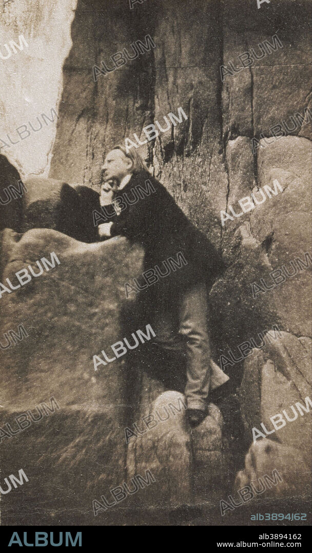 CHARLES HUGO. Victor Hugo dans le rocher des Proscrits Victor Hugo on the Rock of the Exiles. Date/Period: Ca. 1853. Photograph. Salt print. Height: 100 mm (3.93 in); Width: 60 mm (2.36 in).