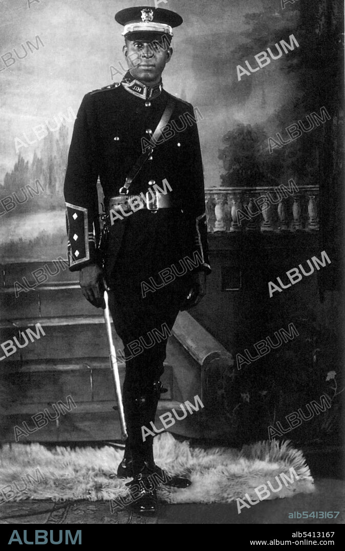 Originally from Saint Ann's Bay, Jamaica, Marcus Garvey left at 23 and traveled throughout Central America and moved for a time to England. During his travels he became convinced that uniting Blacks was the only way to improve their condition. Towards that end, he departed England on June 14, 1914, aboard the SS Trent, returning to Jamaica on July 15, 1914. He traveled to the United States, where he founded the Universal Negro Improvement Association (UNIA) on August 1914 in Akron, Ohio. He intended it to unite all of Africa and its diaspora into one grand racial hierarchy. After traveling through the United States beginning in March 1916, Garvey inaugurated the New York Division of the UNIA in 1917 with 13 members. After three months, the organization's dues-paying membership reached 3,500.  The Pan-African organization enjoyed its greatest strength in the 1920s, and was influential in the United States prior to Garvey's deportation to Jamaica in 1927. After that its prestige and influence declined, but it had a strong influence on African-American history and development. UNIA member not identified, no photographer credited, undated.