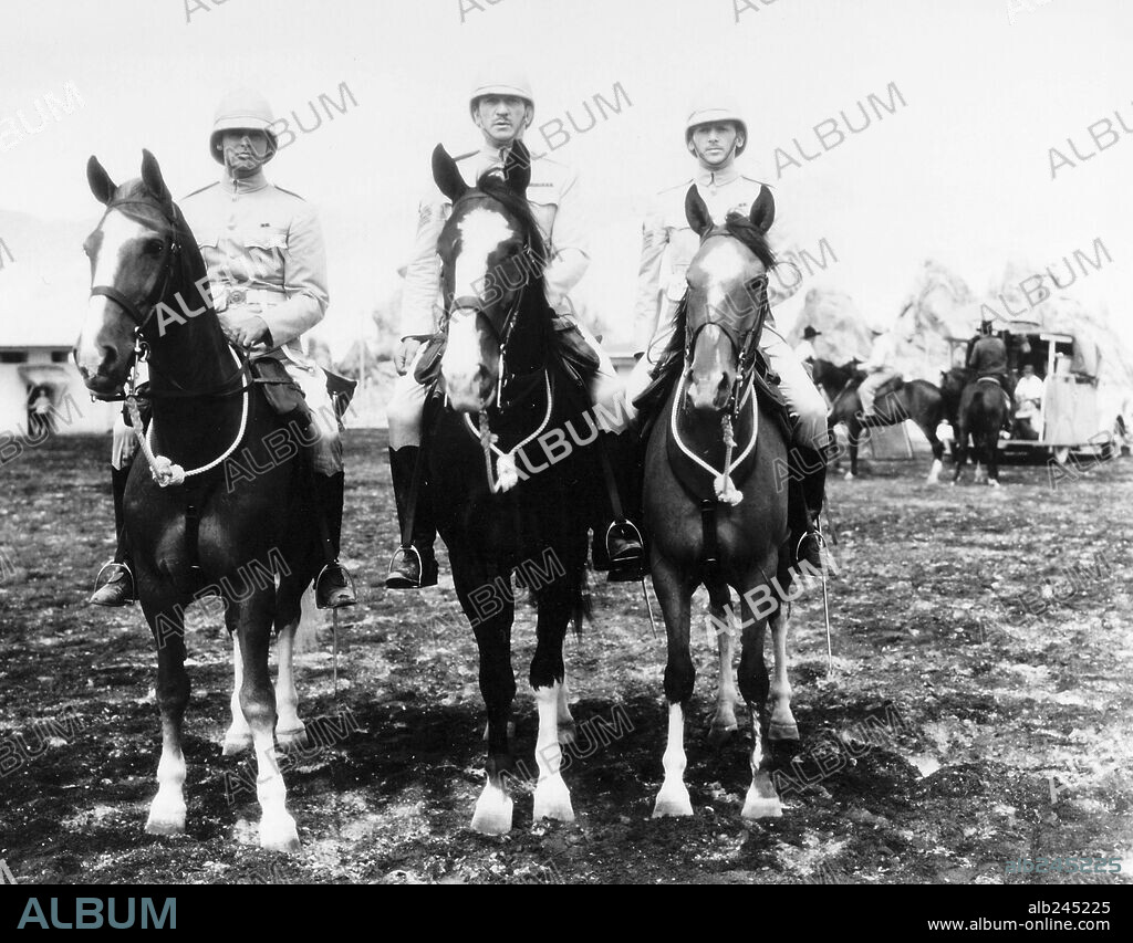 CARY GRANT, DOUGLAS FAIRBANKS JR. and VICTOR McLAGLEN in GUNGA DIN, 1939, directed by GEORGE STEVENS. Copyright RKO.