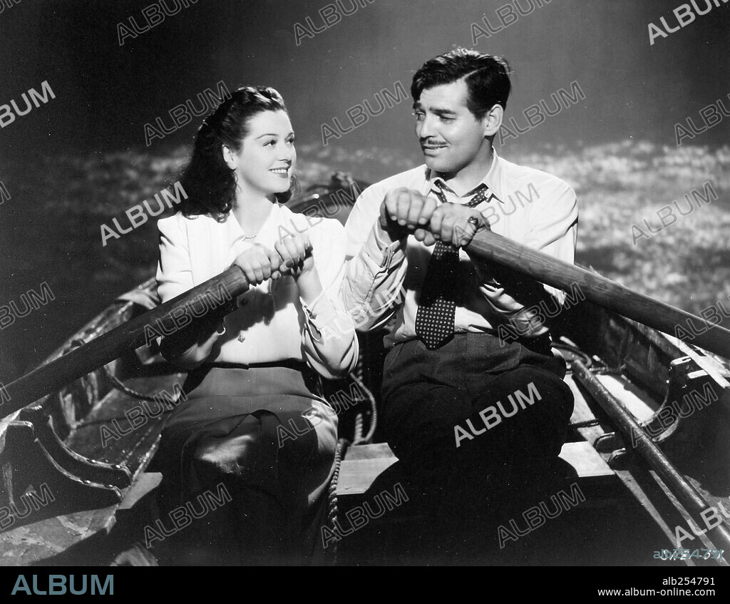 CLARK GABLE and ROSALIND RUSSELL in THEY MET IN BOMBAY, 1941, directed by CLARENCE BROWN. Copyright M.G.M.