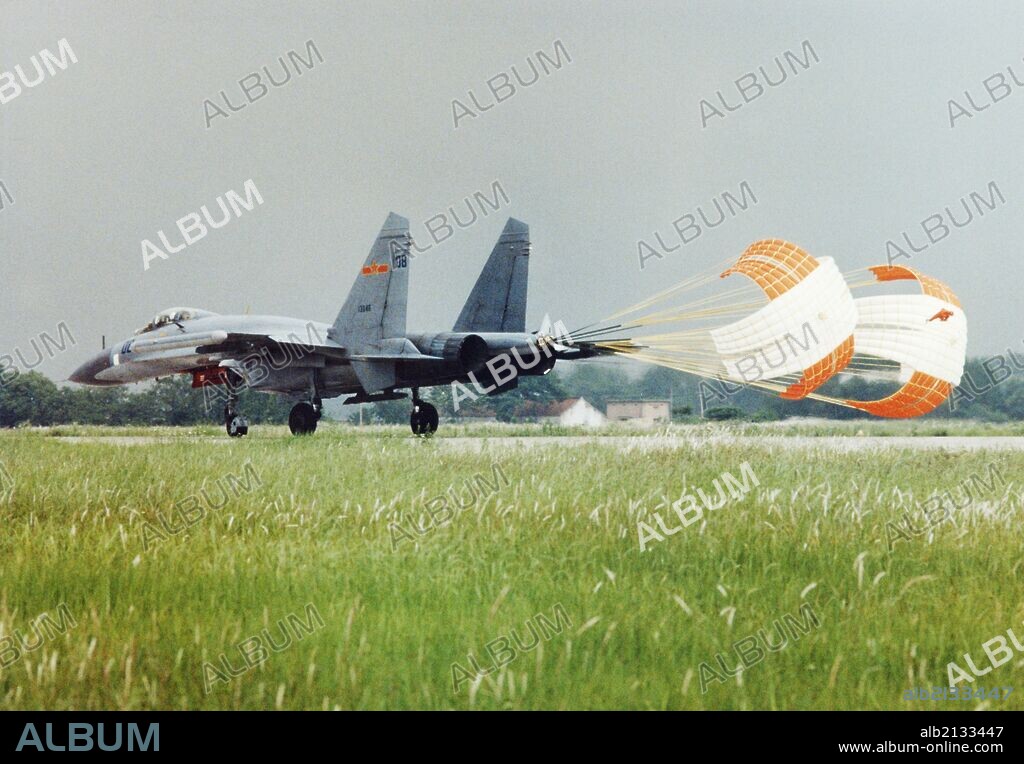 A Russian-made SU-27 fighter jet,the latest addition to the Chinese Air Force, landing on the runway. China. 1998. This jet is also produced in China from kits as the Shenyang J-11. (Photo by: Sovfoto/UIG via Getty Images).