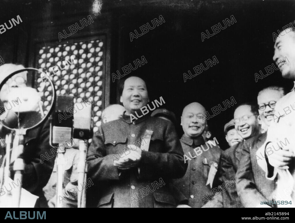 Chairman mao tse tung (center) at the ceremony announcing the founding of the people's republic of china, october 1, 1949, peking (beijing), china, to mao's right: general chu teh, far right: chou en-lai.