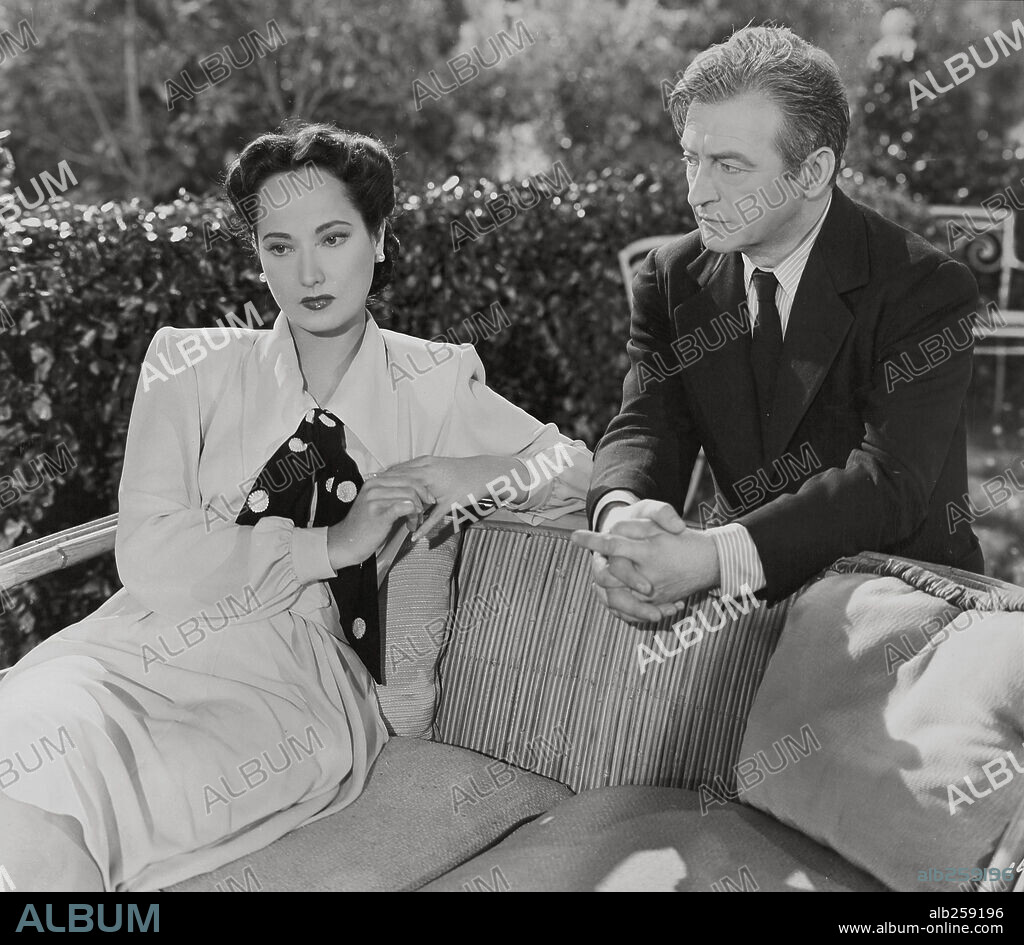CLAUDE RAINS and MERLE OBERON in THIS LOVE OF OURS, 1945, directed by WILHELM DIETERLE. Copyright UNIVERSAL PICTURES.