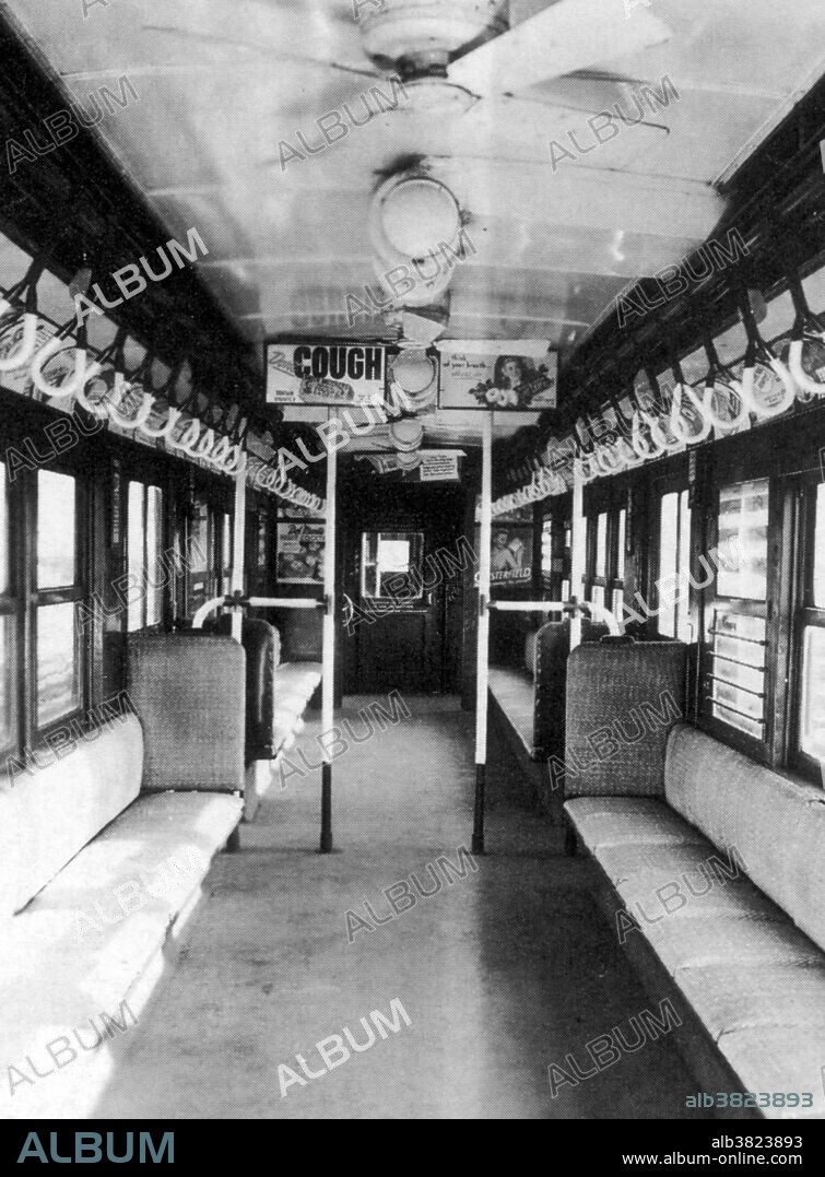 The Flivver Lo-V was a type of New York City Subway. Individual, square rattan seats were arranged in a longitudinal seating pattern along the side walls of the car. Three doors on each side - two at the end vestibules and one in the center - provided for entrance and exit from the car. Incandescent lighting was used, and paddle ceiling fans cooled the car. Clerestory style vents in the upper roof opened for additional airflow. The carbody was made entirely of steel, with drop sash windows running down the sides of the car. The cars used metal signage displayed in the side windows of the car to indicate destinations and route. Kerosene lamps were displayed on the ends of trains as running lights - white for the front of the train and red for the rear.