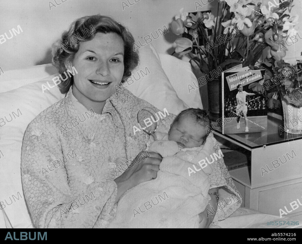 Born ***** Tennis Racket in his Hand..Mrs. Joy Mottram with her son at the Wimbledon Nursing home today. Well-known tennis star Joy Mottram Shows off her new 91b son. Father Tony Mottram was playing in the hardcourt tennis championships at Bournemouth but took time off to dash to the Wimbledon Maternity home to greet his new son. Tony predicts another tennis champ in the family. April 23, 1955. (Photo by Paul Popper, Paul Popper Ltd.).
