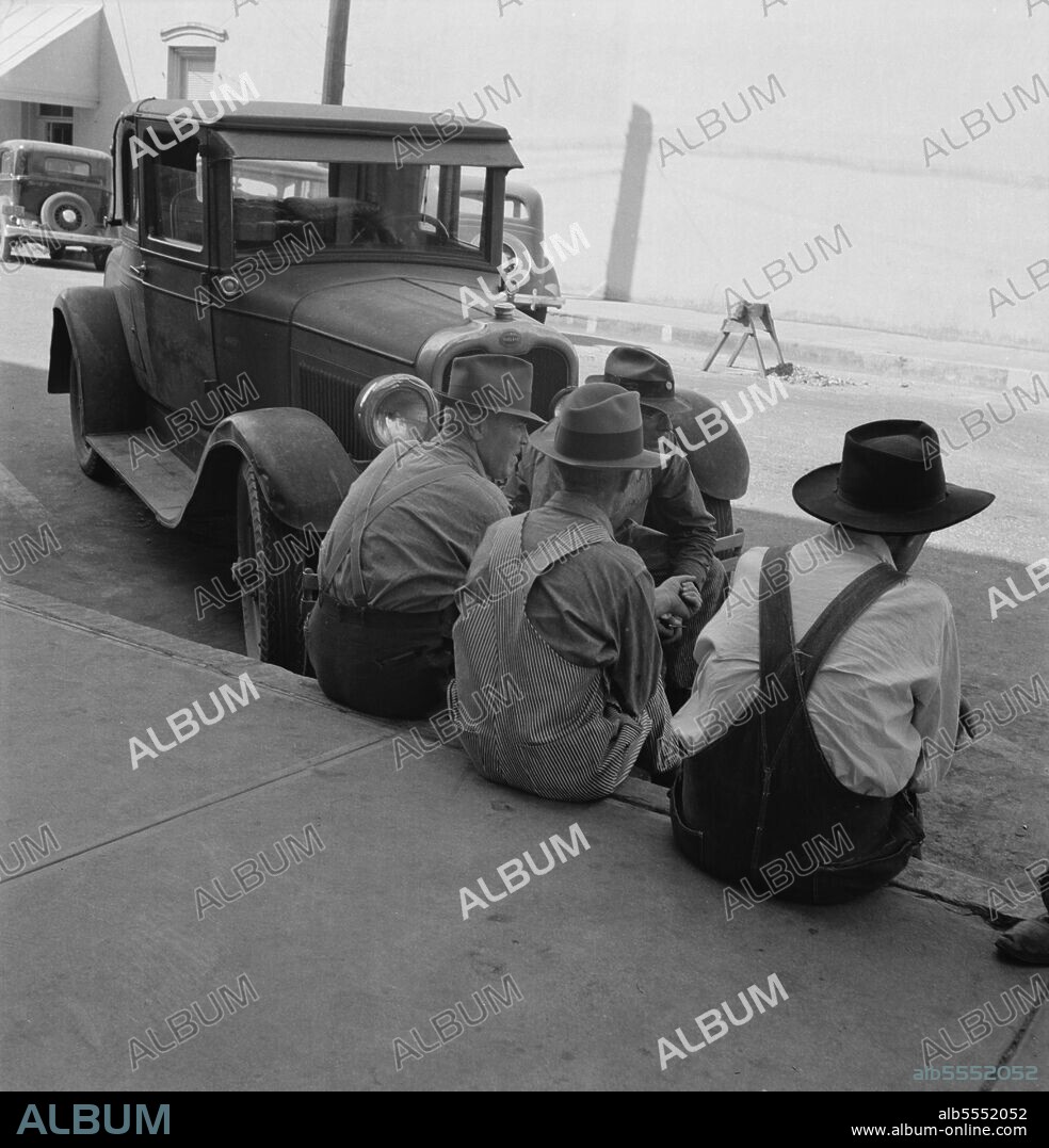 DOROTHEA LANGE. Williamette Valley hop farmers in town hold their political forum on drug store corner. Independence, Oregon.