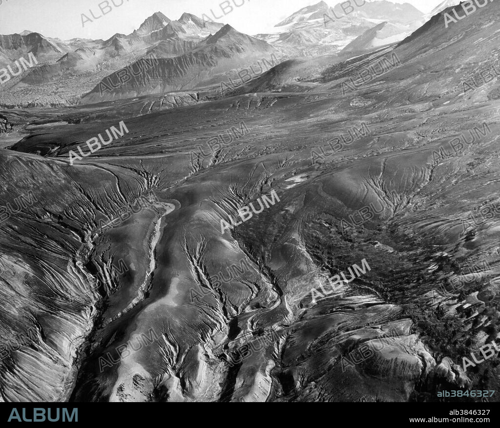 The Valley of Ten Thousand Smokes, a valley within Katmai National Park and Preserve in Alaska which is filled with ash flow from the eruption of Novarupta on June 6-8, 1912. Following the eruption, thousands of fumaroles vented steam from the ash. Robert F. Griggs, who explored the volcano's aftermath for the National Geographic Society in 1916, gave the valley its name, saying that "the whole valley as far as the eye could reach was full of hundreds, no thousands--literally, tens of thousands--of smokes curling up from its fissured floor.".