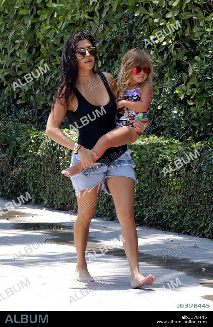May 3, 2016 - Miami, FL, United States - Kourtney Kardashian and her daughter Penelope Disick walking to the beach on May 3 2016 in Miami, Florida. 03/05/2016