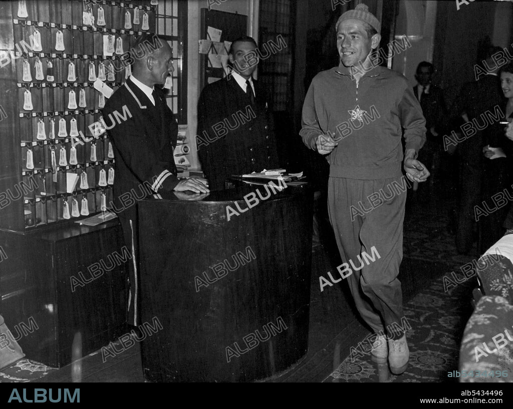 Zatopek Arrives In London -- Emil Zatopek, who will meet Pirie again after his defeat by Pirie in Prague, leaving his hotel for a practice run. The Prague athletic team who are to compete against London at White City arrived today at London Airport. October 11, 1955. (Photo by Daily Herald).