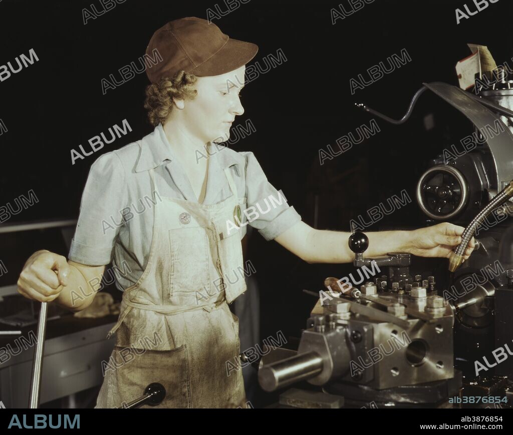 October 1942 - Woman reaming tools for transport on lathe machine at the Consolidated Aircraft Corporation plant in Fort Worth, Texas.