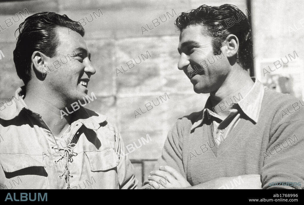 Partisans during the Second World War. The partisan chief Piero Urati, also known as 'Piero', operating in Turin area, is talking with one of his men. Italy, 1945.