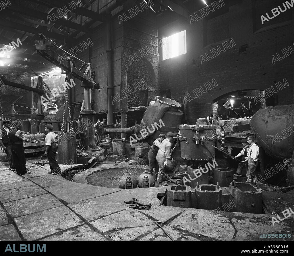 Steel production at the Cammell Laird works, Penistone, Yorkshire, 1913. Men at work in Cammell Laird's bessemer department, producing steel from pig iron. One of a series of photographs of Cammell Laird works.